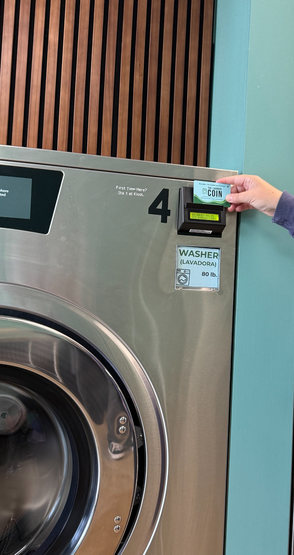 Tapping a Laundry Coin card at the reader on an 80 lb washer
