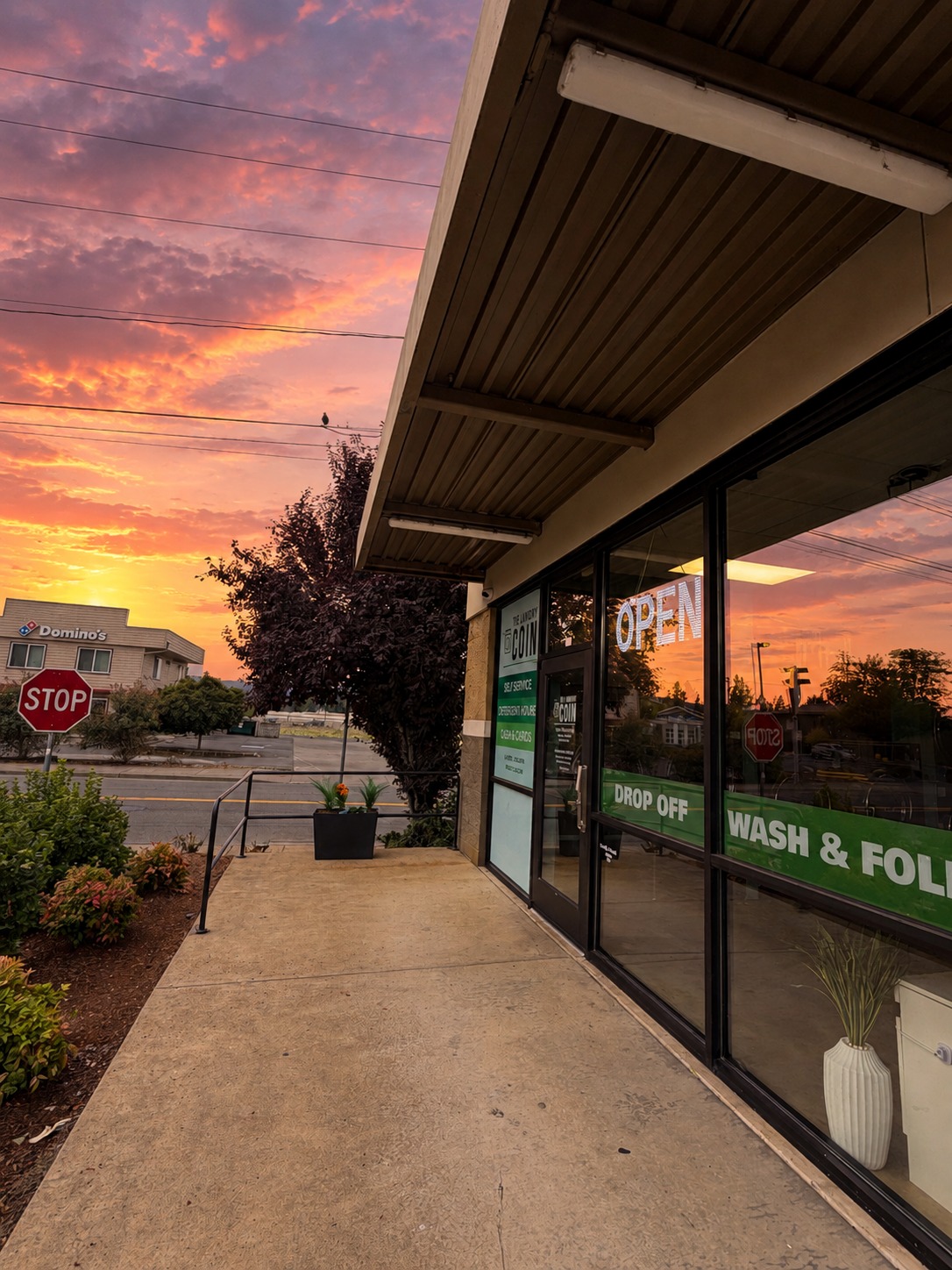 The Laundry Coin storefront at sunset on E. Main Street