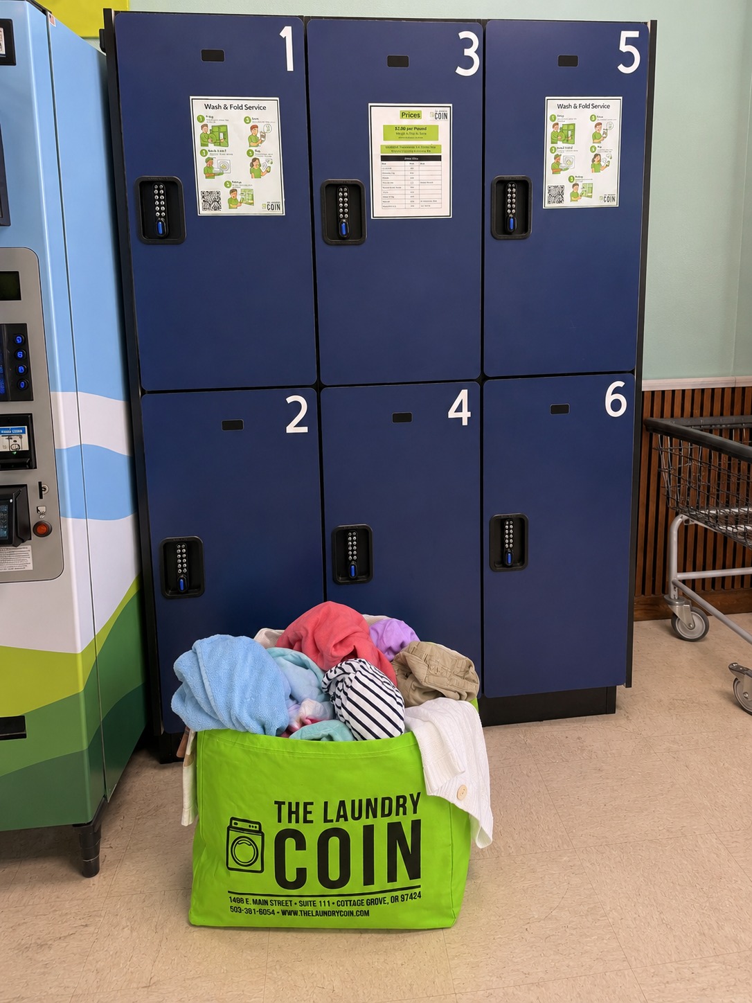 A full Laundry Coin Wash & Fold bag in front of the numbered lockers